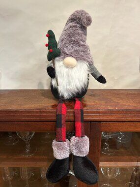 Christmas Holiday Gnome with gray cap and wispy white beard, holding tree